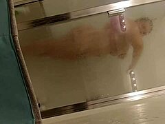 Mature mommy enjoys a hot shower with her lover
