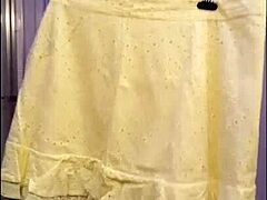 Mature crossdresser tries on new skirts in HD video